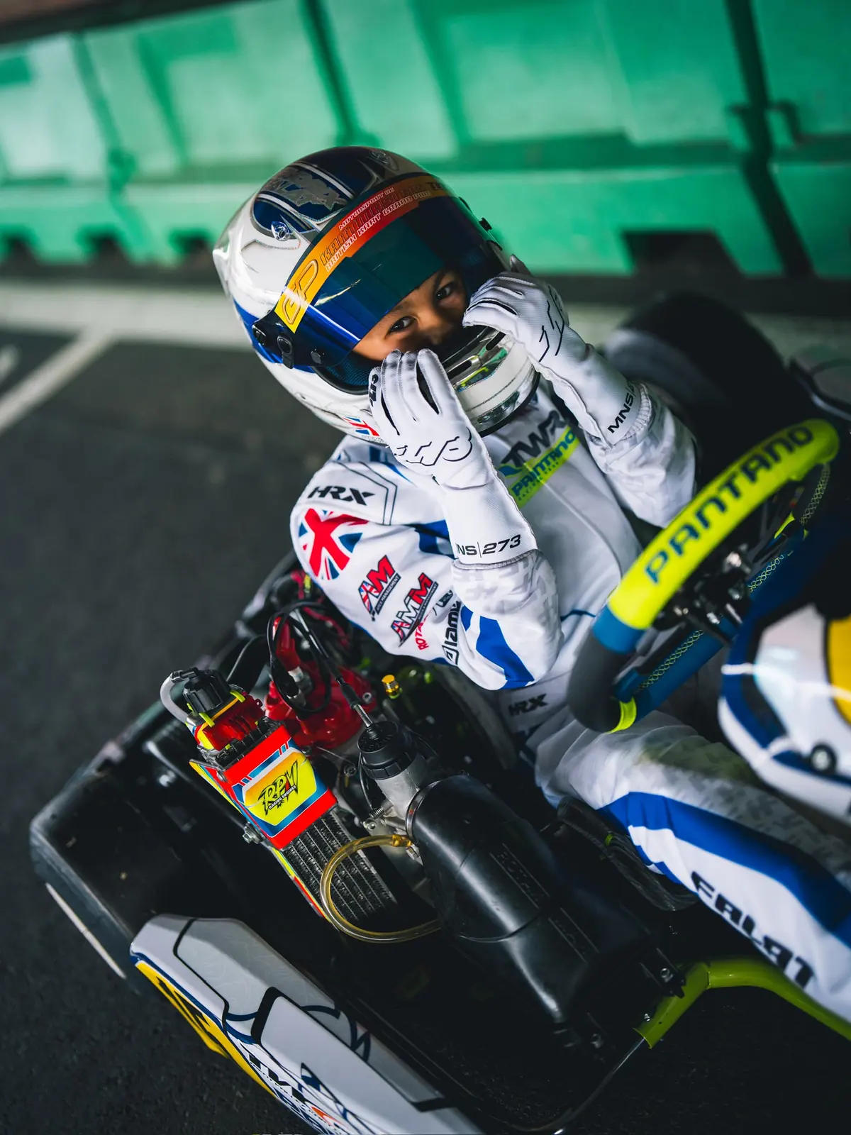 Head-on portrait of Hendrix Falat in the kart, race number 15 on the nose