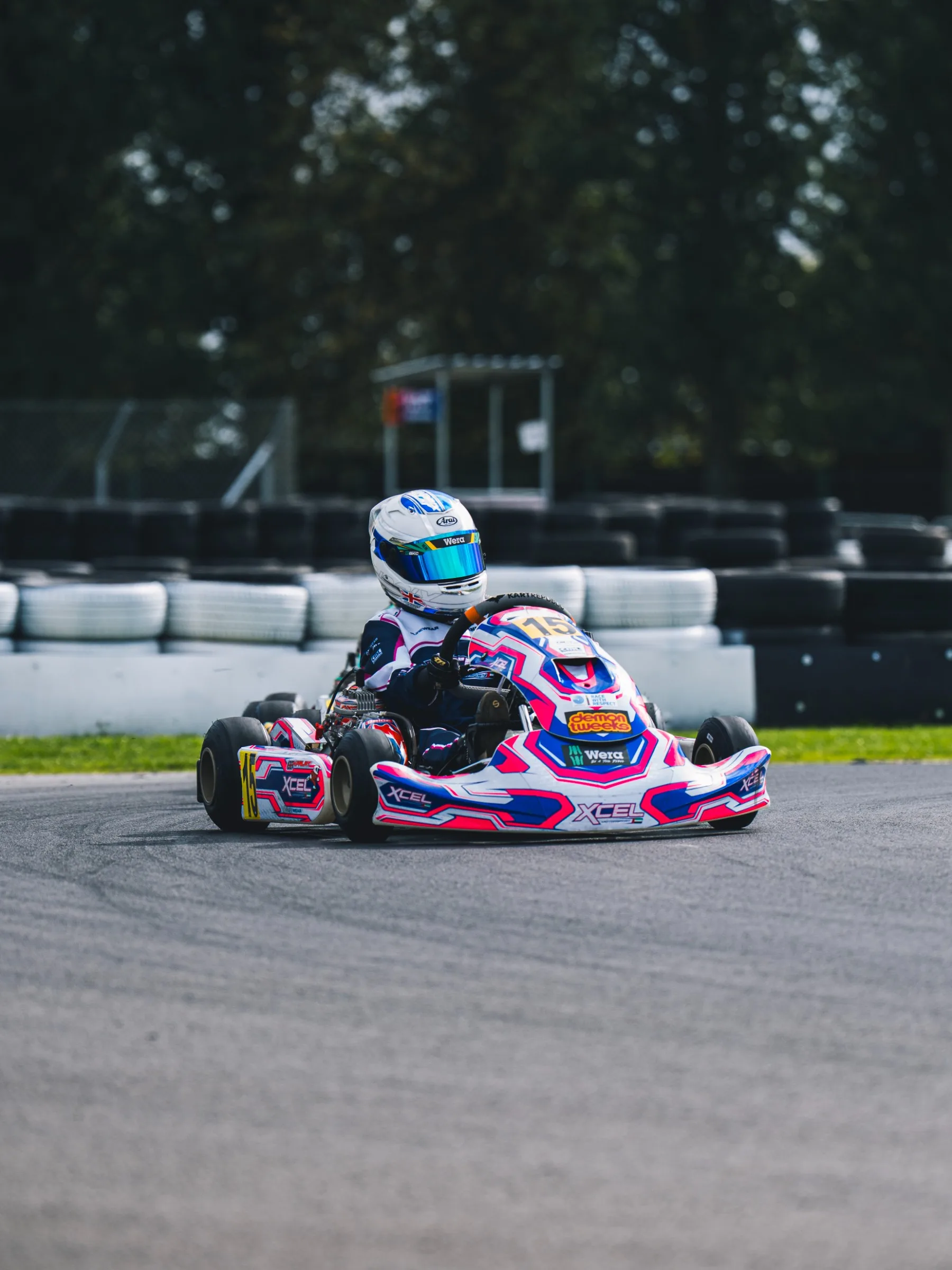 Hendrix Falat raising a fist from kart #15 at PF International after taking the win